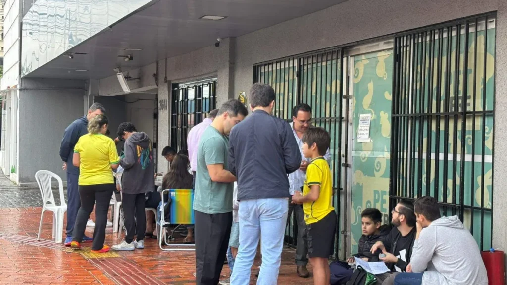 Brazil kids keep trading cards despite rain and Brazil game