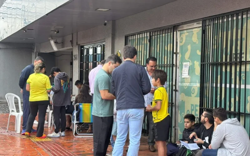 Brazil kids keep trading cards despite rain and Brazil game