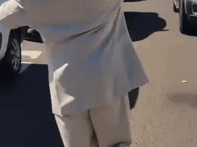Brazil street vendor sells water, spreads education in sharp suit